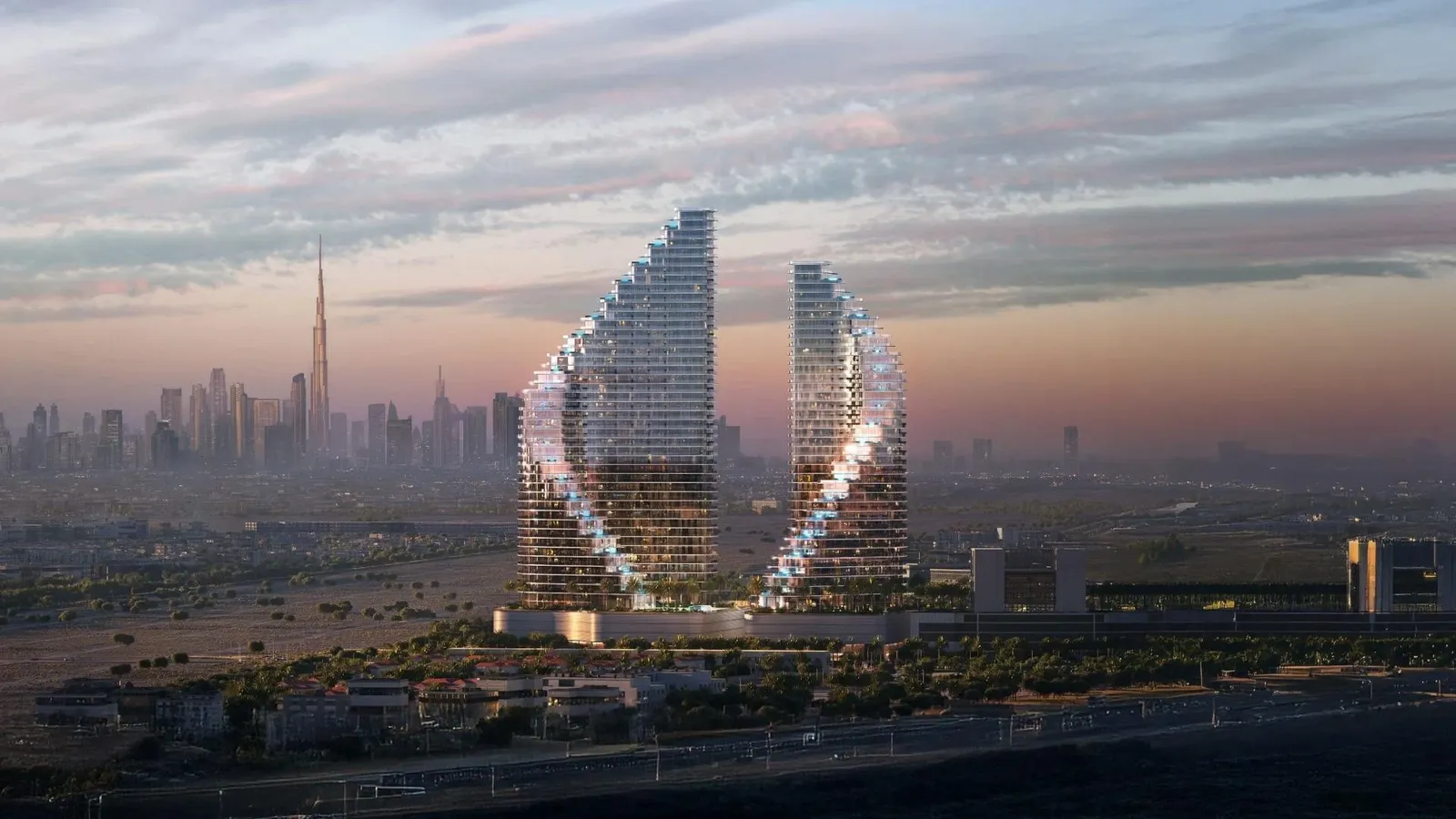 Binghatti Flare'in iki kulesi ve Dubai silueti, akşam