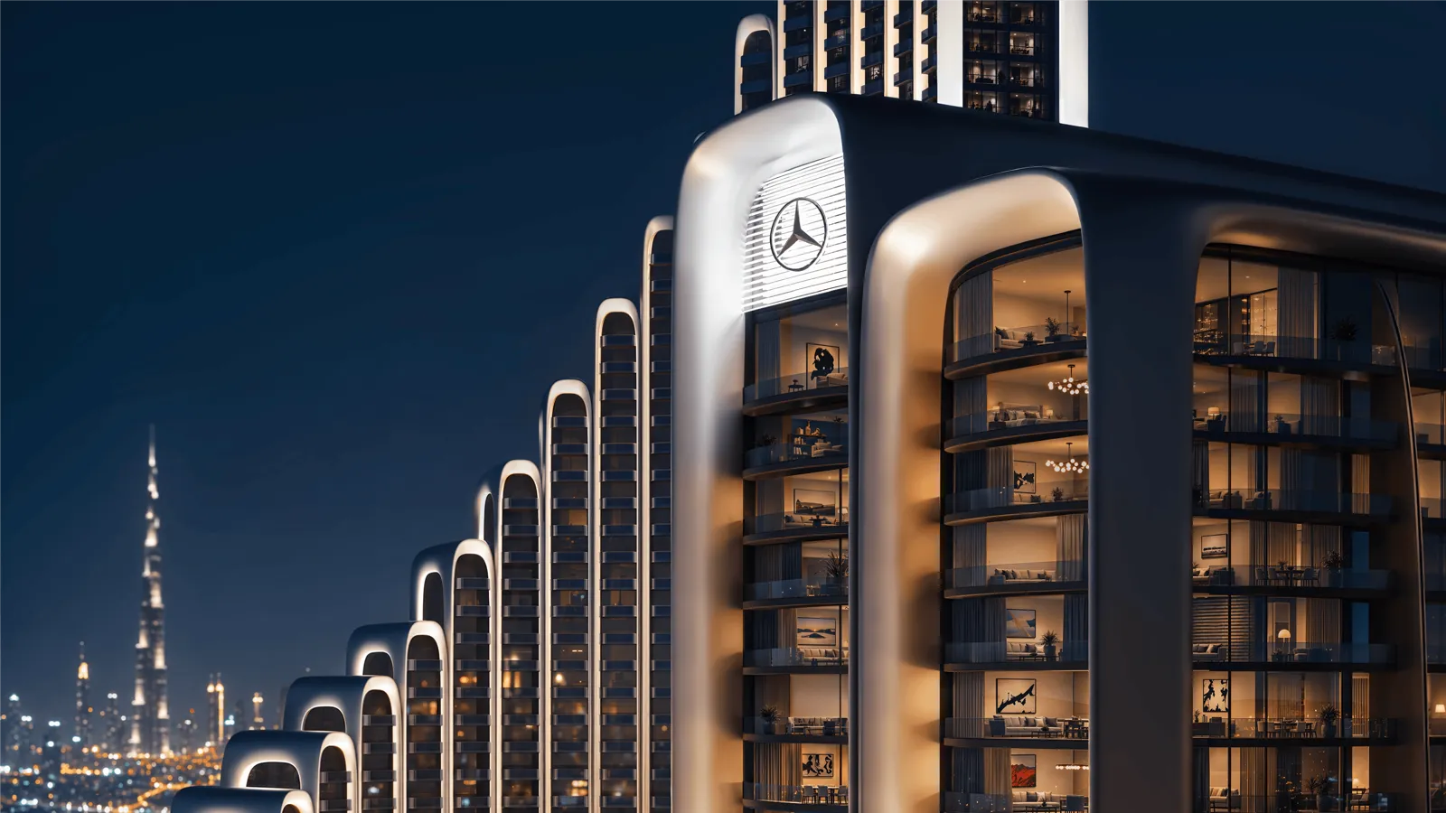 Vision Iconic kulesinin Mercedes-Benz amblemli cephesi ve arka planda Burj Khalifa